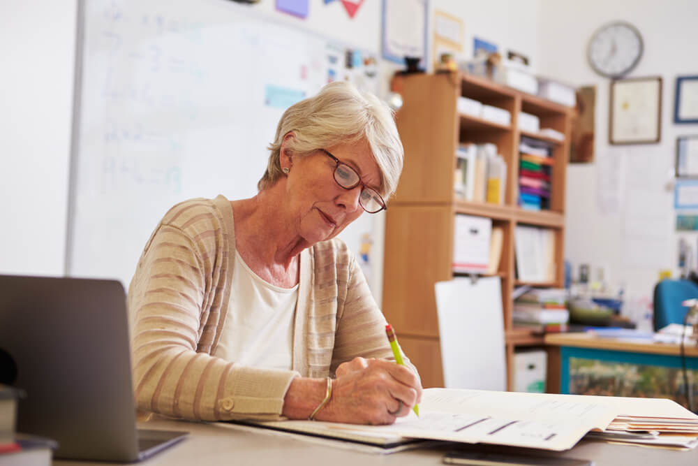 A teacher writes back to a student in their journal.