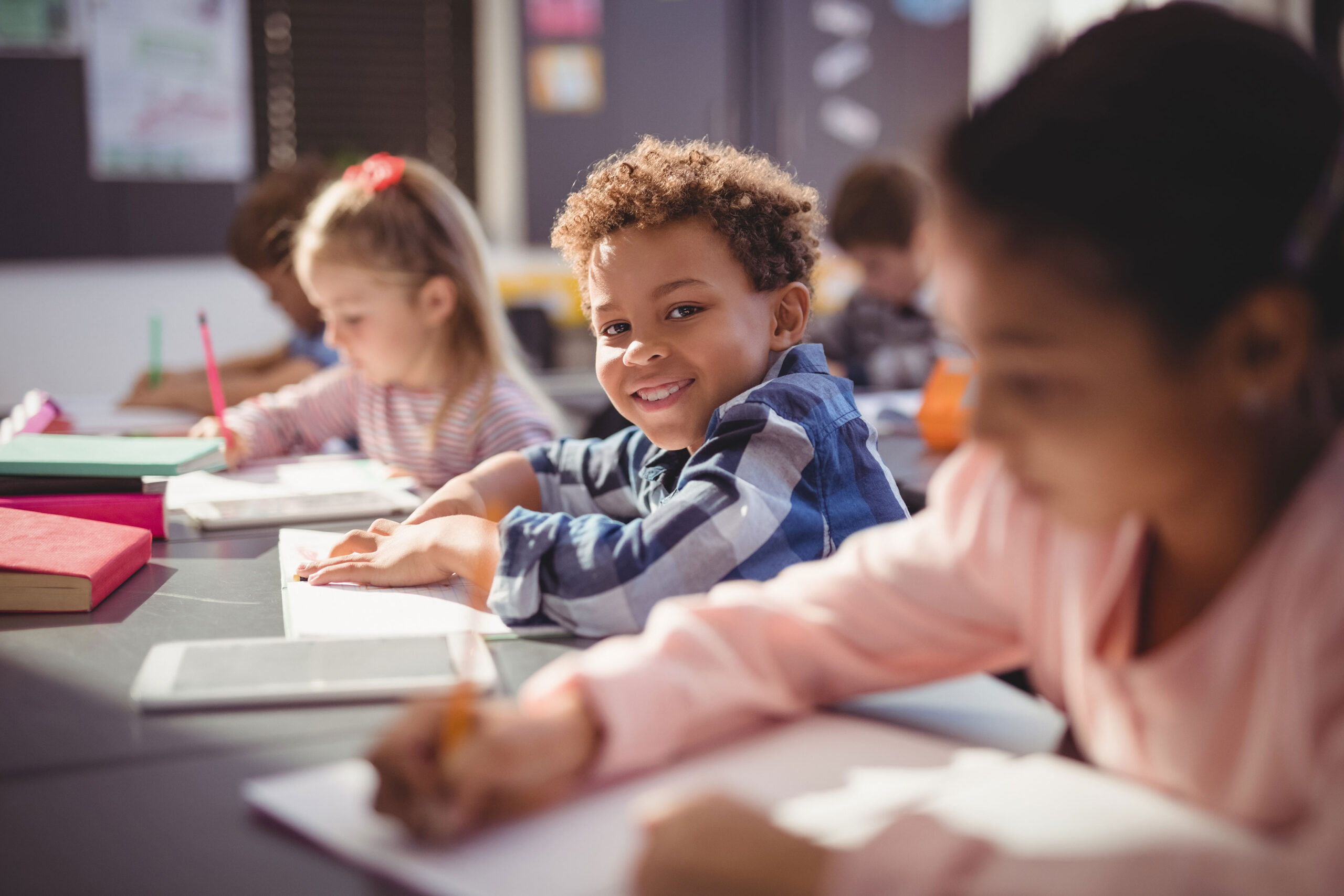 A smiling boy at school.