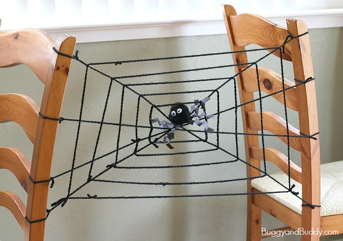 Halloween STEM activity with yarn spider webs