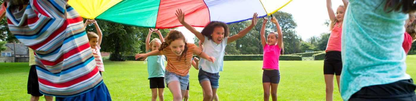 Children play a parachute game