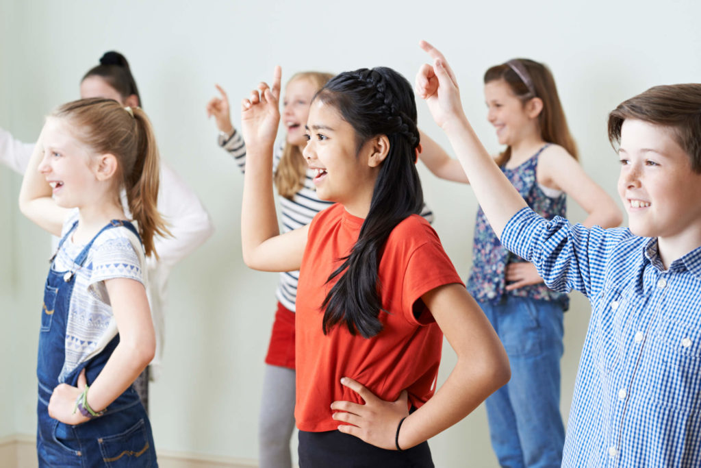 Students dance in the classroom as part of a brain break
